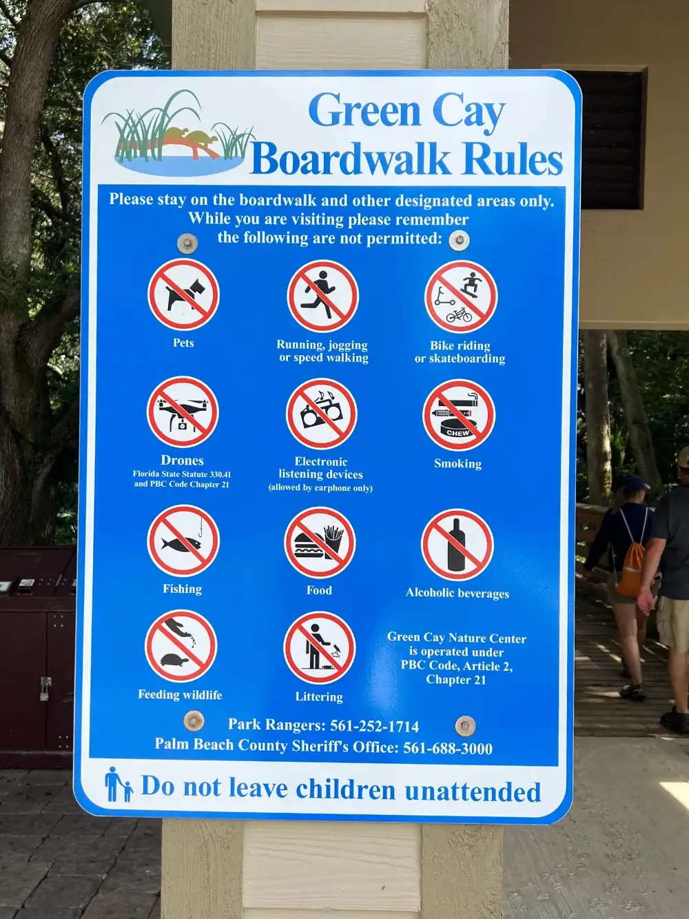 Sign with text reading Green Cay Boardwalk rules with ten rules