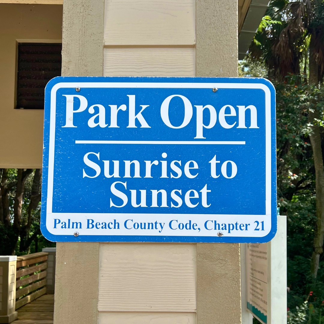 Sign with text sunrise to sunset, the hours Green Cay Wetlands and Nature Center boardwalk is open