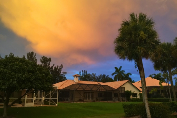 Stormy clouds during sunset over residential local homes in Palm Beach county Florida