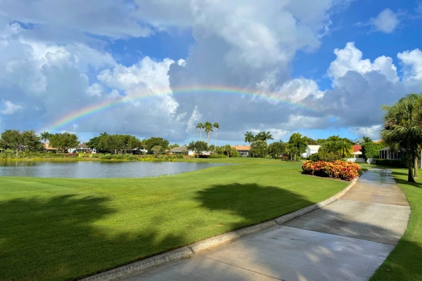 Rainbow over a lake on a golf course in Boca Raton Florida