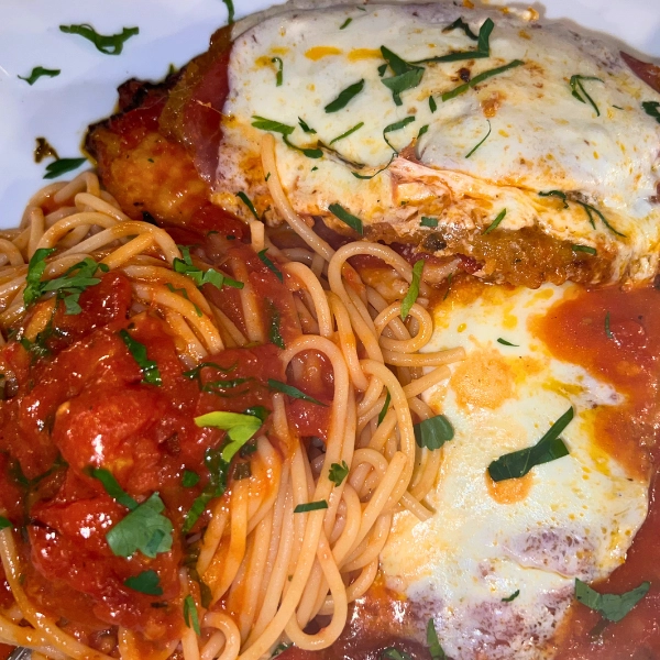 Chicken Parmigiana with spaghetti and marinara sauce at Pizza Time Caffe in Parkland Florida