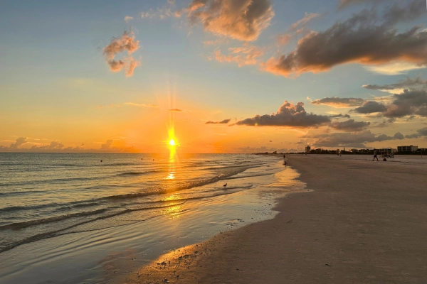 Orange and yellow sky sunset of Sarasota Siesta Key beach a favorite for locals