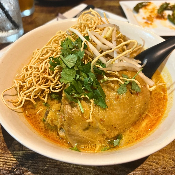 bowl of khao soi with chicken and crisoy noodles best dish at Sen Thai Bistro in Boca Raton Florida