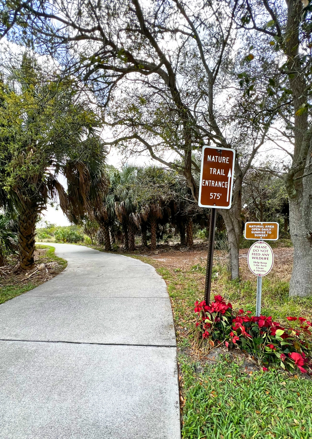 Pondhawk Natural Area Nature Trail Entrance with path and sign