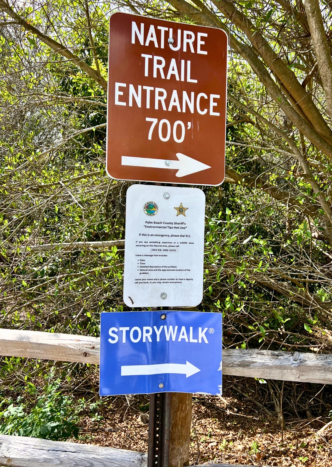 Pondhawk Natural Area Nature Trail Entrance sign and storywalk sign