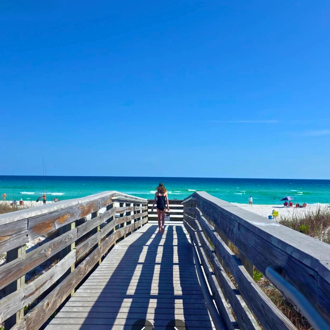 person on navarre beach boardwalk in Florida Panhandle